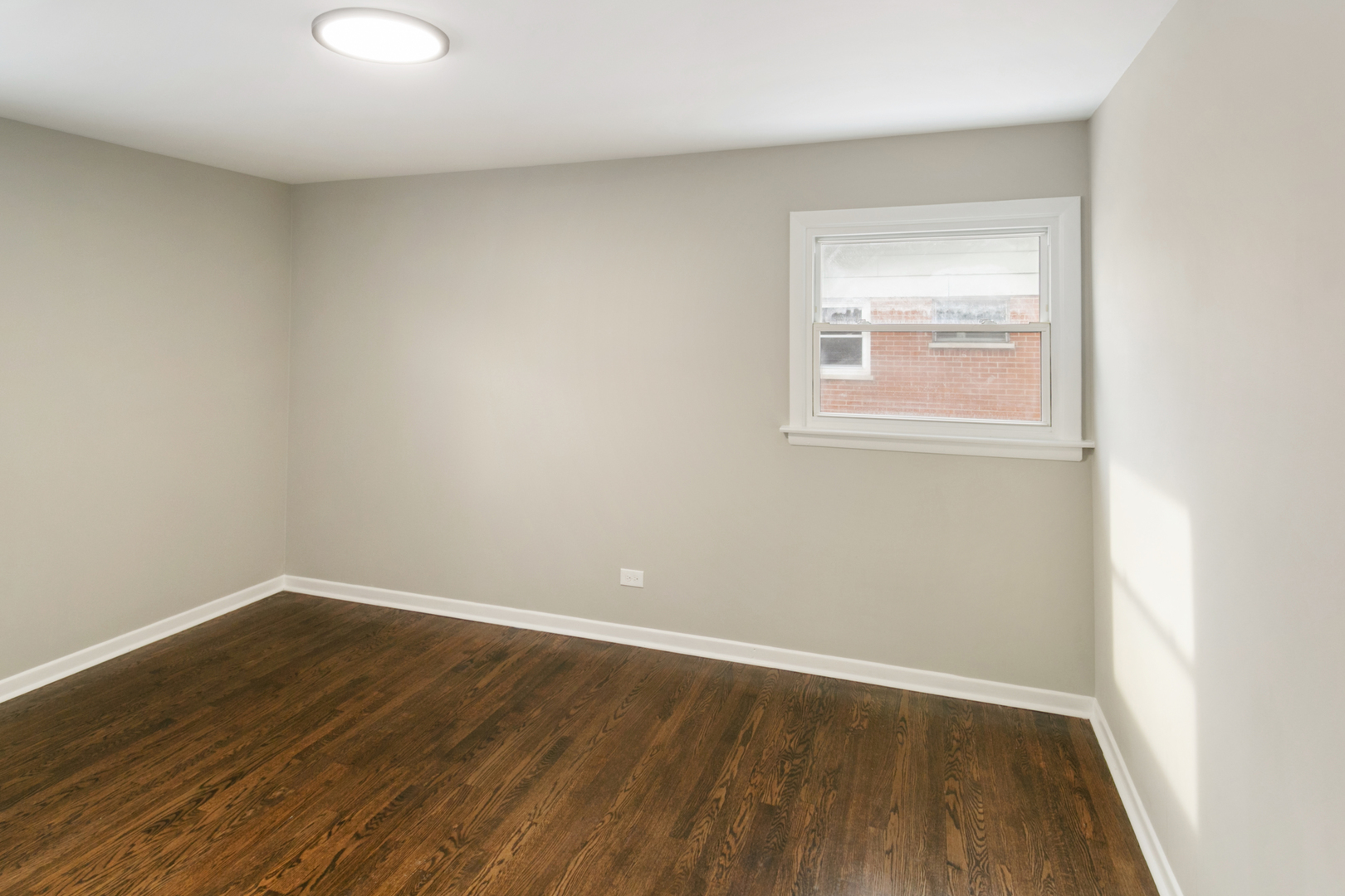 214 North Gay Court Glenwood, IL 60425 - Photo 13 of 20 an empty room with wooden floor and windows