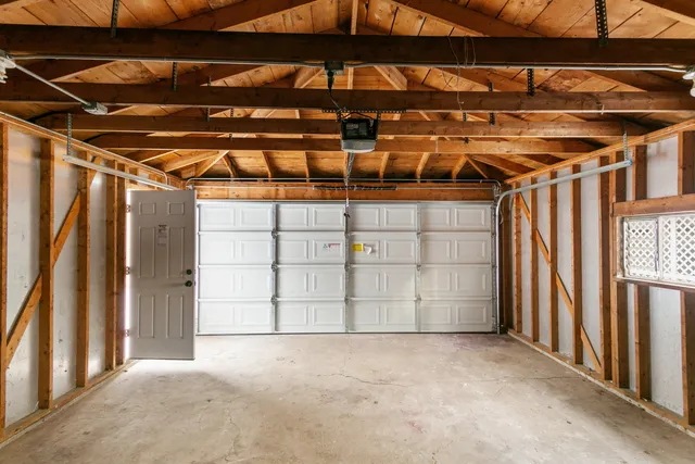 a view of a room with wooden walls