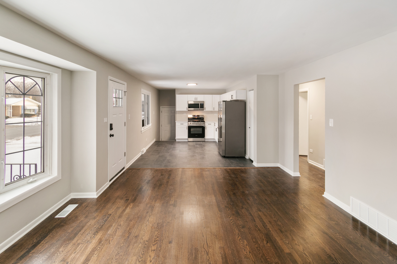 214 North Gay Court Glenwood, IL 60425 - Photo 4 of 20 wooden floor in an empty room with a window