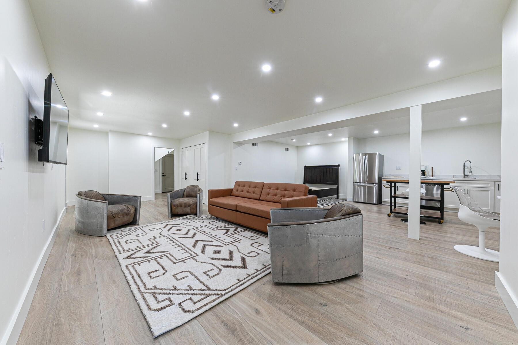 8585 River Road Truckee, CA 96161 - Photo 28 of 28 a living room with furniture a flat screen tv and kitchen view