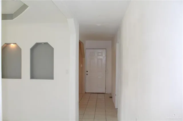 a bed room with a bed and a glass door