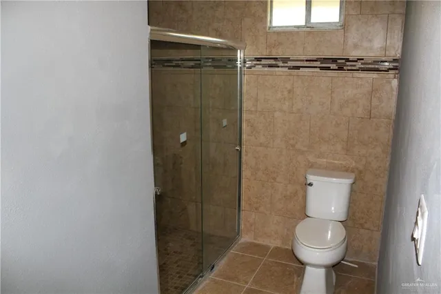a bathroom with a glass shower door