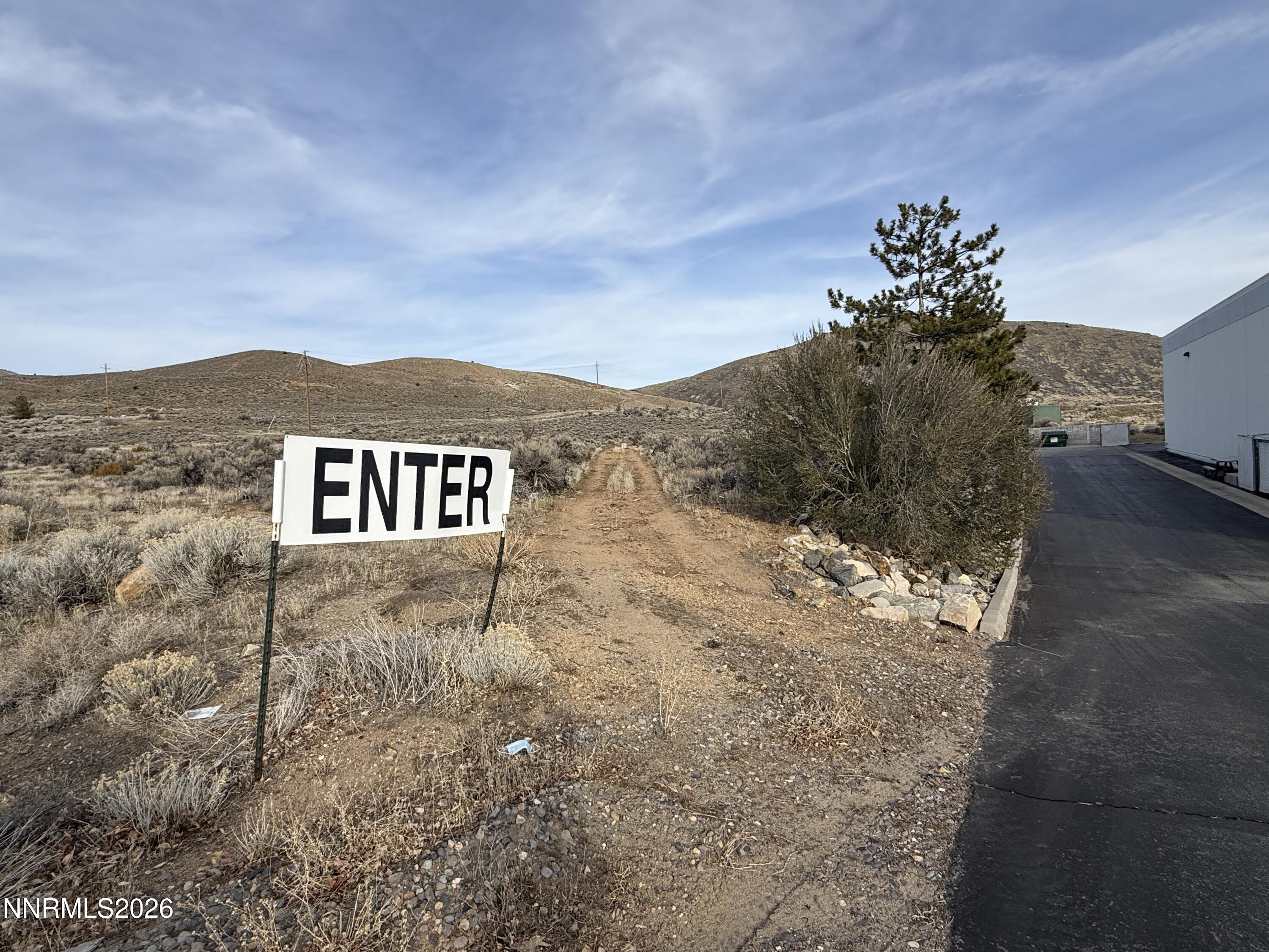 a view of a dry yard with mountain