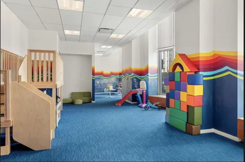 a children room with toys and a couch