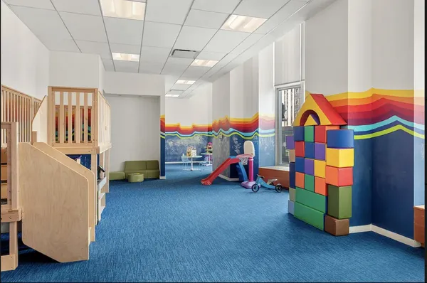 a children room with toys and a couch