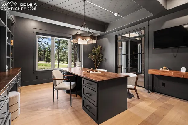 a view of a dining room with furniture window and outside view