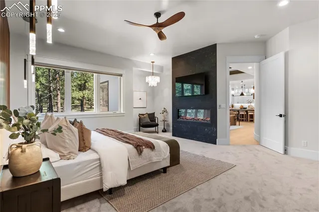 a spacious bedroom with a large bed and a large window