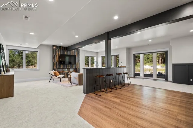 a room with lots of furniture and windows