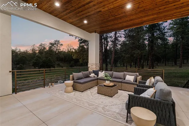 a outdoor living space with patio furniture and a garden