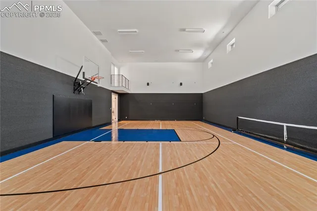 a view of a room with wooden floor