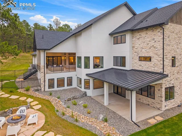 a aerial view of a house with a swimming pool