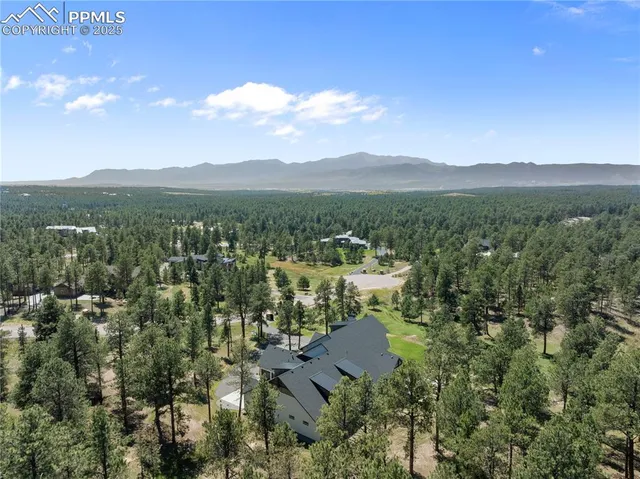 a aerial view of a house with a swimming pool