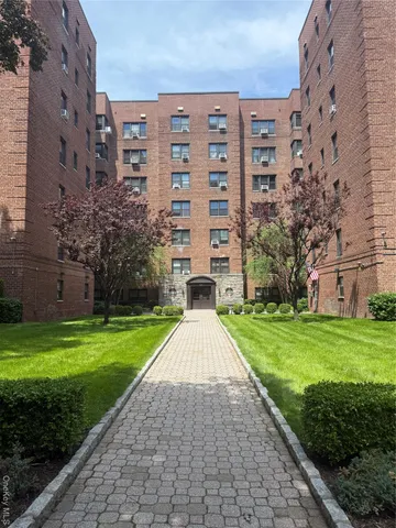 a view of a building with a yard