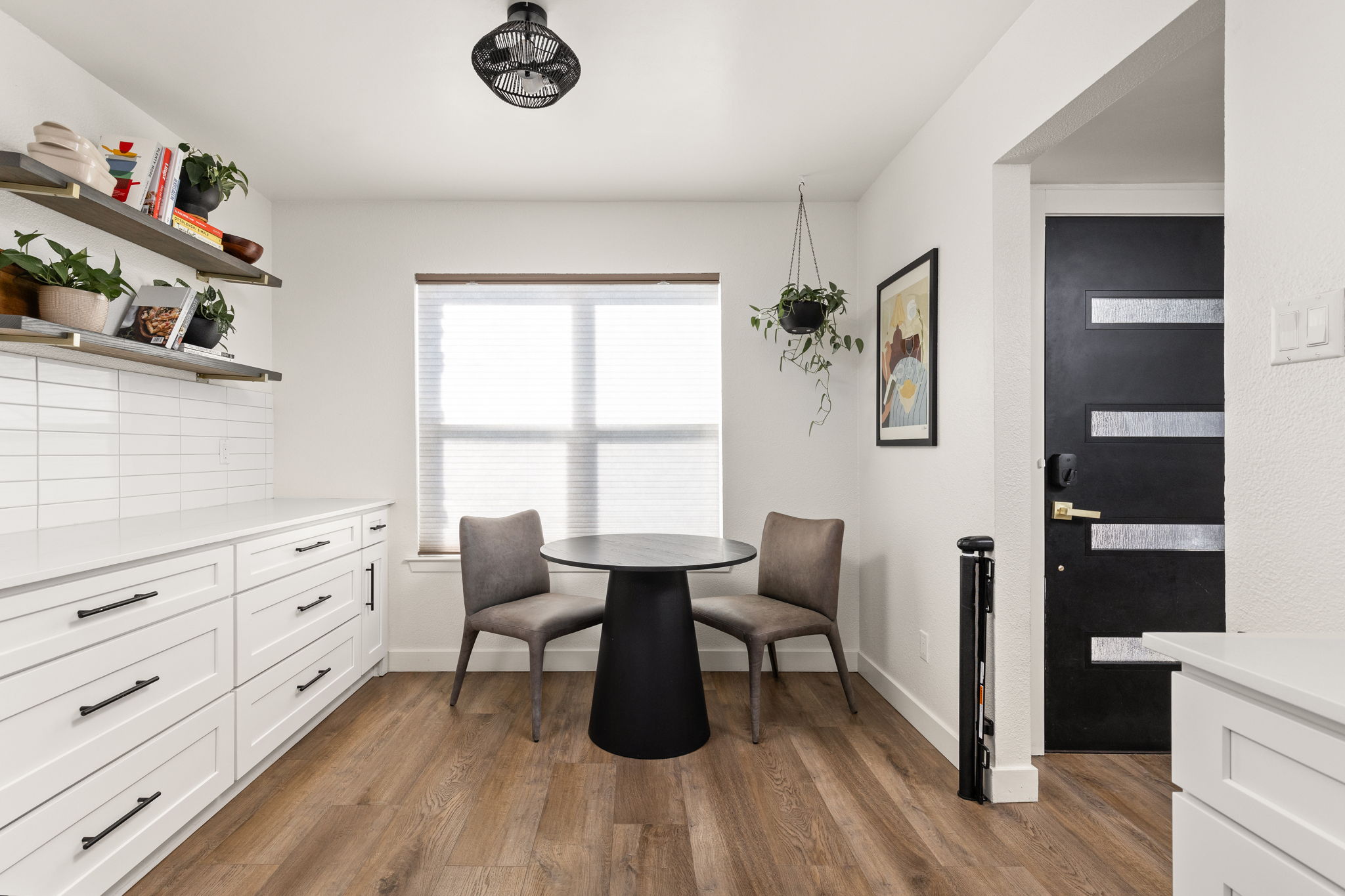 7909 Manassas Drive Austin, TX 78745 - Photo 11 of 37 Dining room featuring dark wood-type flooring and baseboards