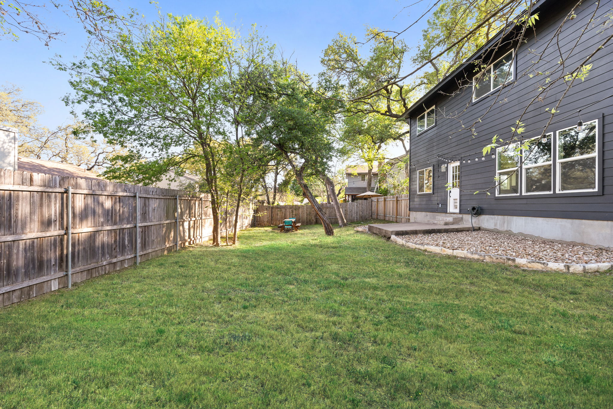 7909 Manassas Drive Austin, TX 78745 - Photo 14 of 37 View of fenced backyard