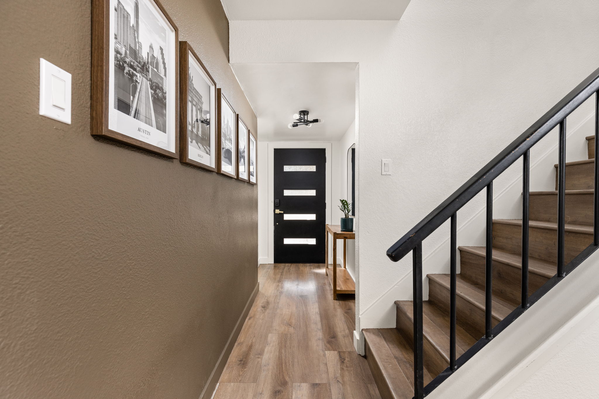 7909 Manassas Drive Austin, TX 78745 - Photo 17 of 37 Entryway featuring a textured wall and wood finished floors