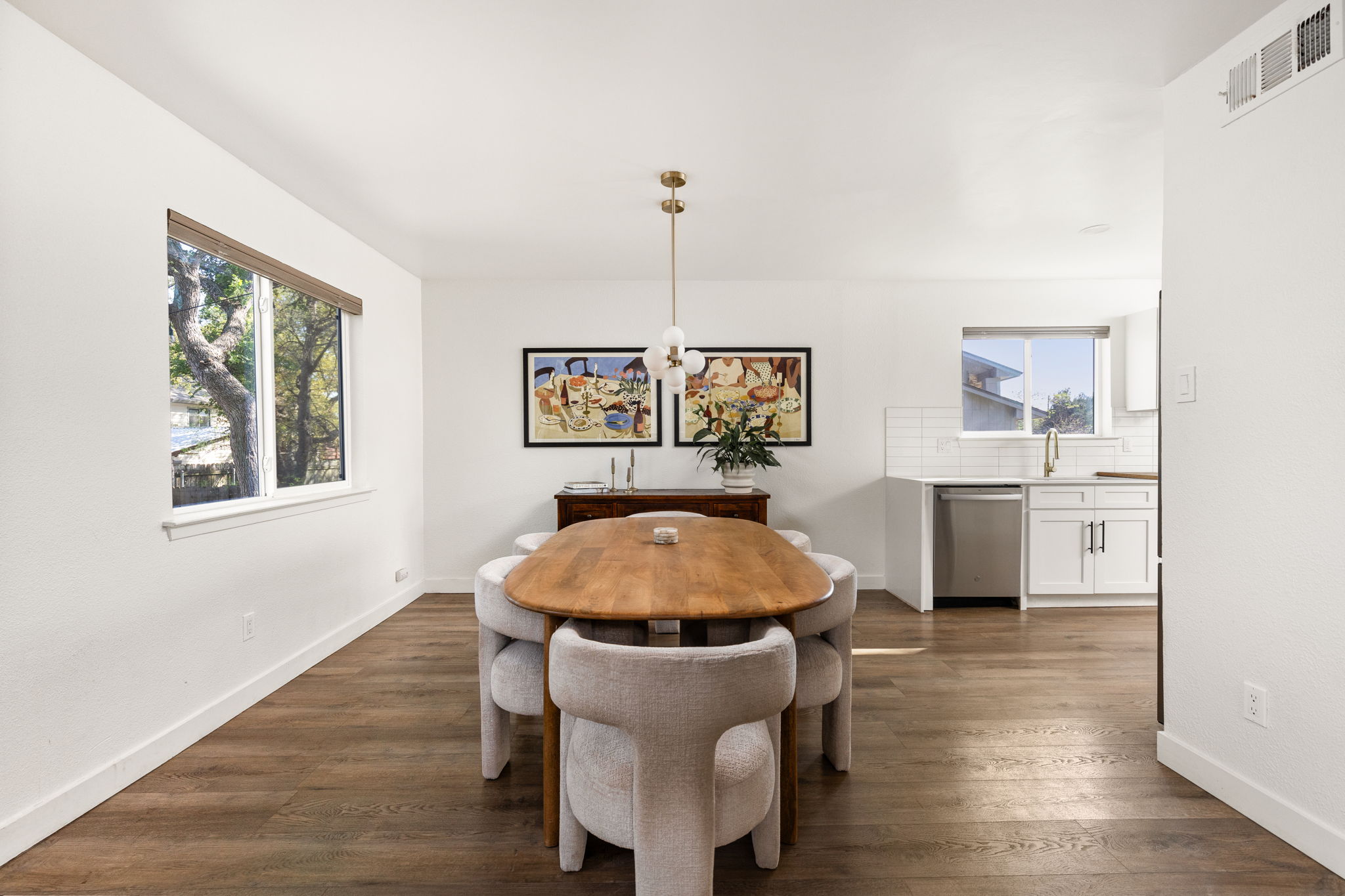 7909 Manassas Drive Austin, TX 78745 - Photo 21 of 37 Dining space featuring dark wood-style floors and baseboards