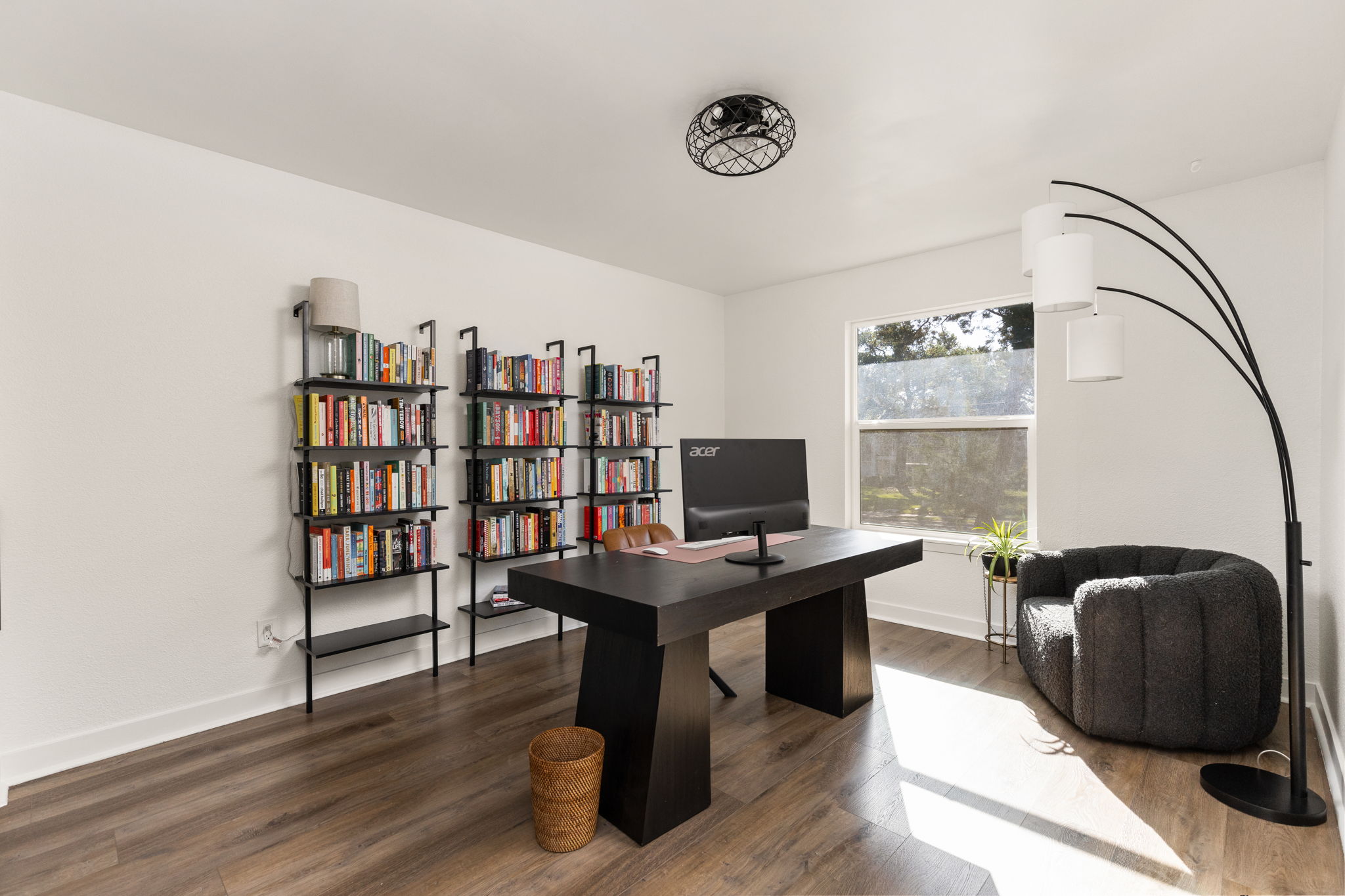 7909 Manassas Drive Austin, TX 78745 - Photo 31 of 37 Home office with dark wood-style floors and baseboards