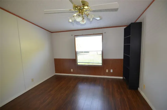 a view of backyard with swimming pool and green space