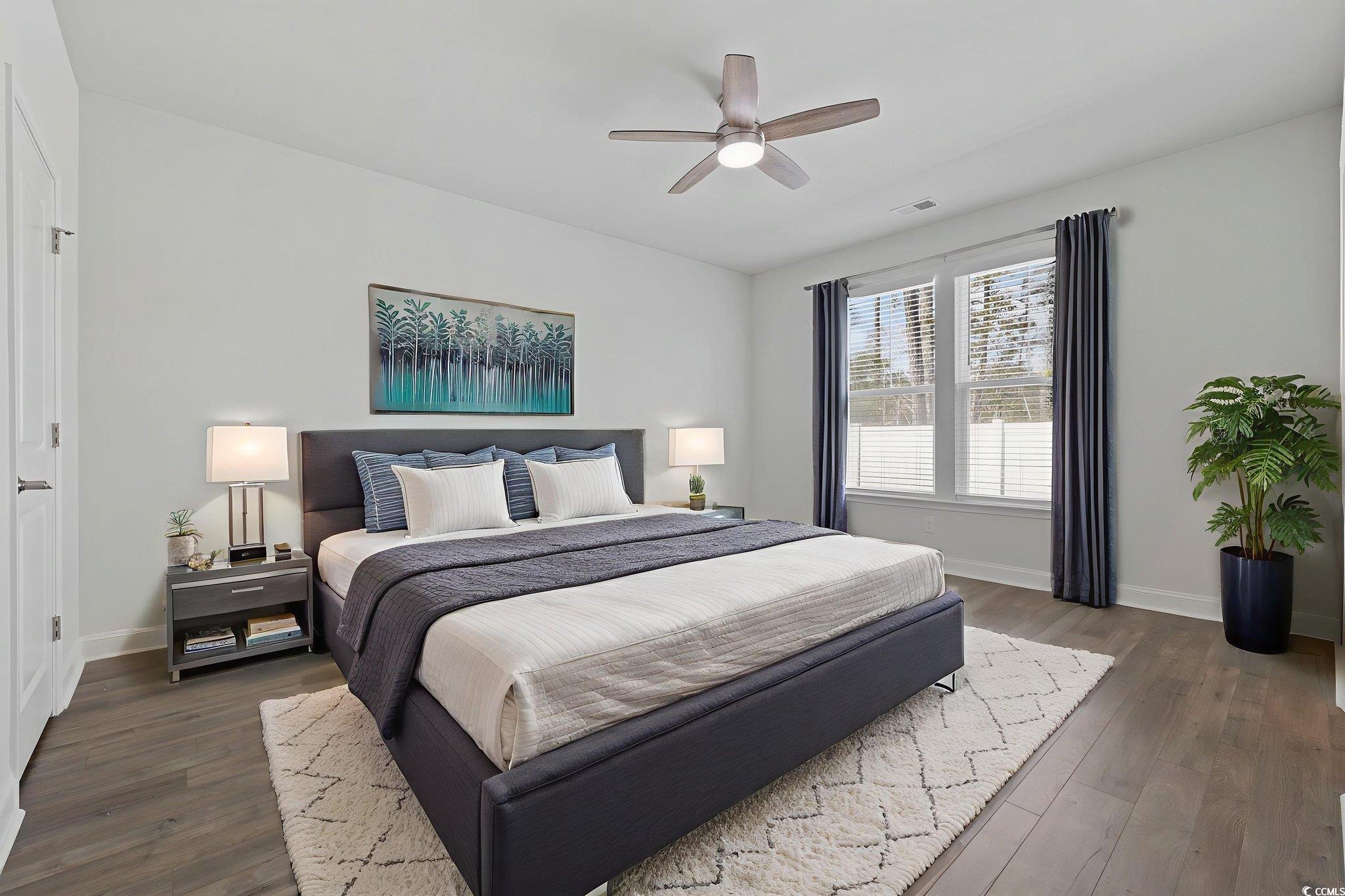 2595 Blue Crane Circle, Unit 102 Myrtle Beach, SC 29577 - Photo 16 of 40 Bedroom with a ceiling fan and dark wood-type flooring