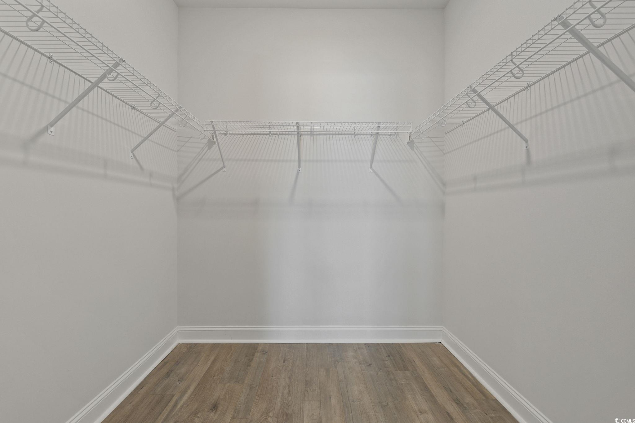 2595 Blue Crane Circle, Unit 102 Myrtle Beach, SC 29577 - Photo 18 of 40 Spacious closet with wood finished floors