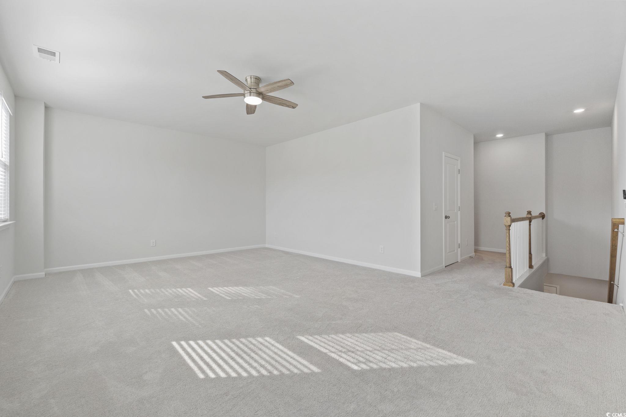 2595 Blue Crane Circle, Unit 102 Myrtle Beach, SC 29577 - Photo 25 of 40 Spare room featuring carpet, a ceiling fan, and recessed lighting