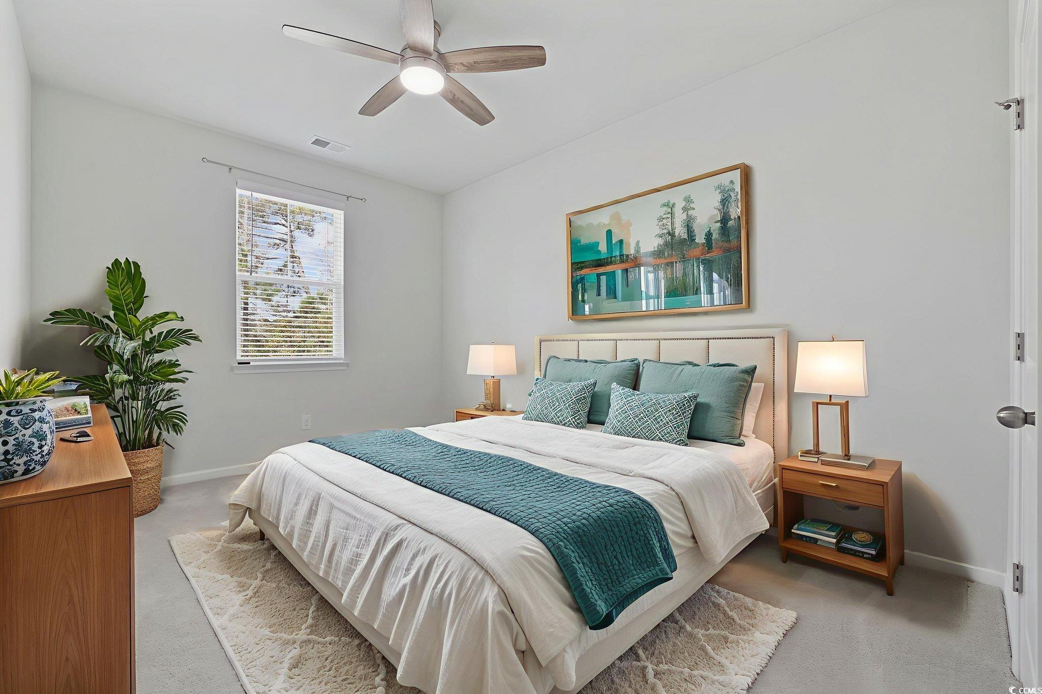 2595 Blue Crane Circle, Unit 102 Myrtle Beach, SC 29577 - Photo 29 of 40 Carpeted bedroom with a ceiling fan and baseboards