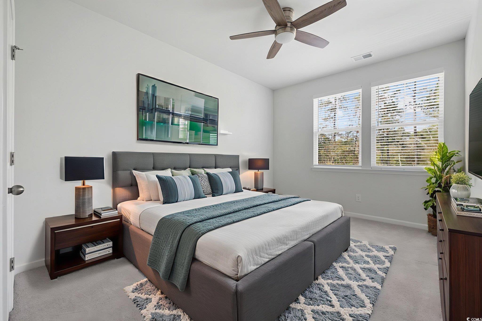 2595 Blue Crane Circle, Unit 102 Myrtle Beach, SC 29577 - Photo 32 of 40 Bedroom with a ceiling fan and light carpet