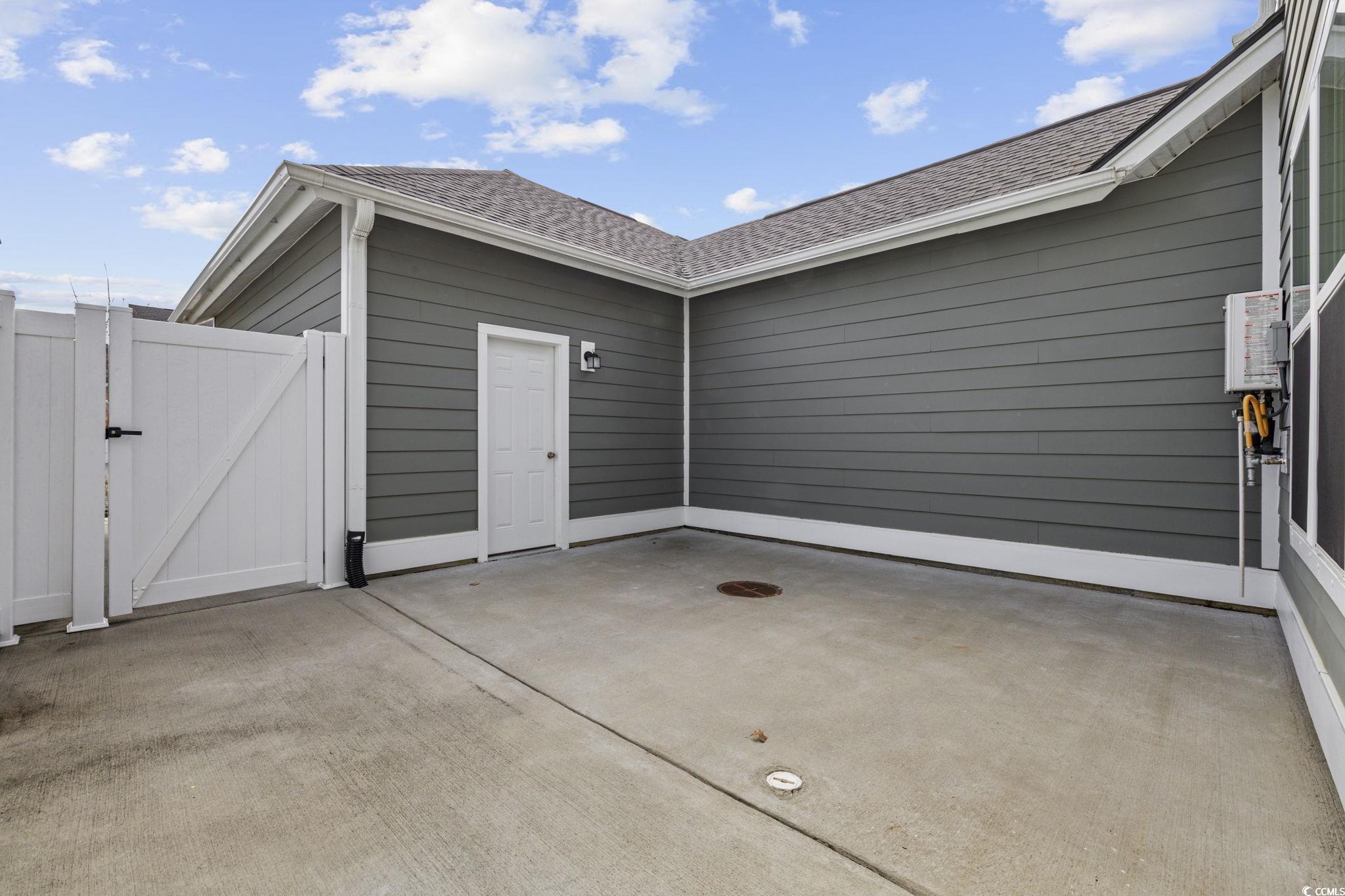 2595 Blue Crane Circle, Unit 102 Myrtle Beach, SC 29577 - Photo 5 of 40 View of patio / terrace featuring a gate
