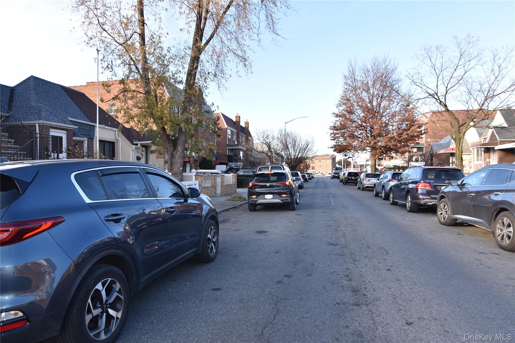 25-48 89th Street Queens, NY 11369 - Photo 16 of 17 a car parked in front of a house