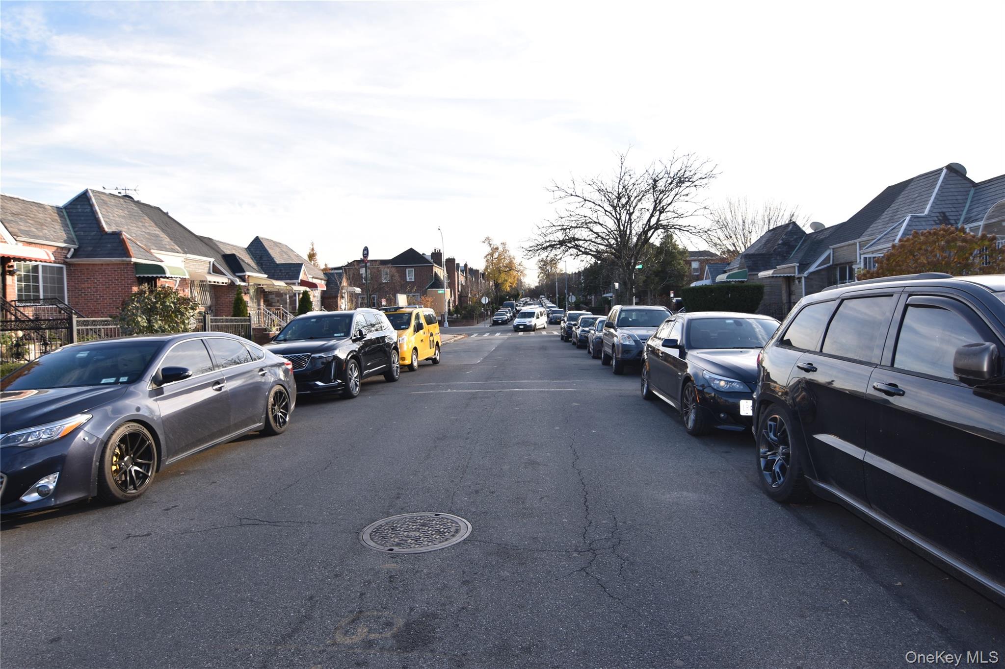 25-48 89th Street Queens, NY 11369 - Photo 17 of 17 a view of cars parked in a parking lot