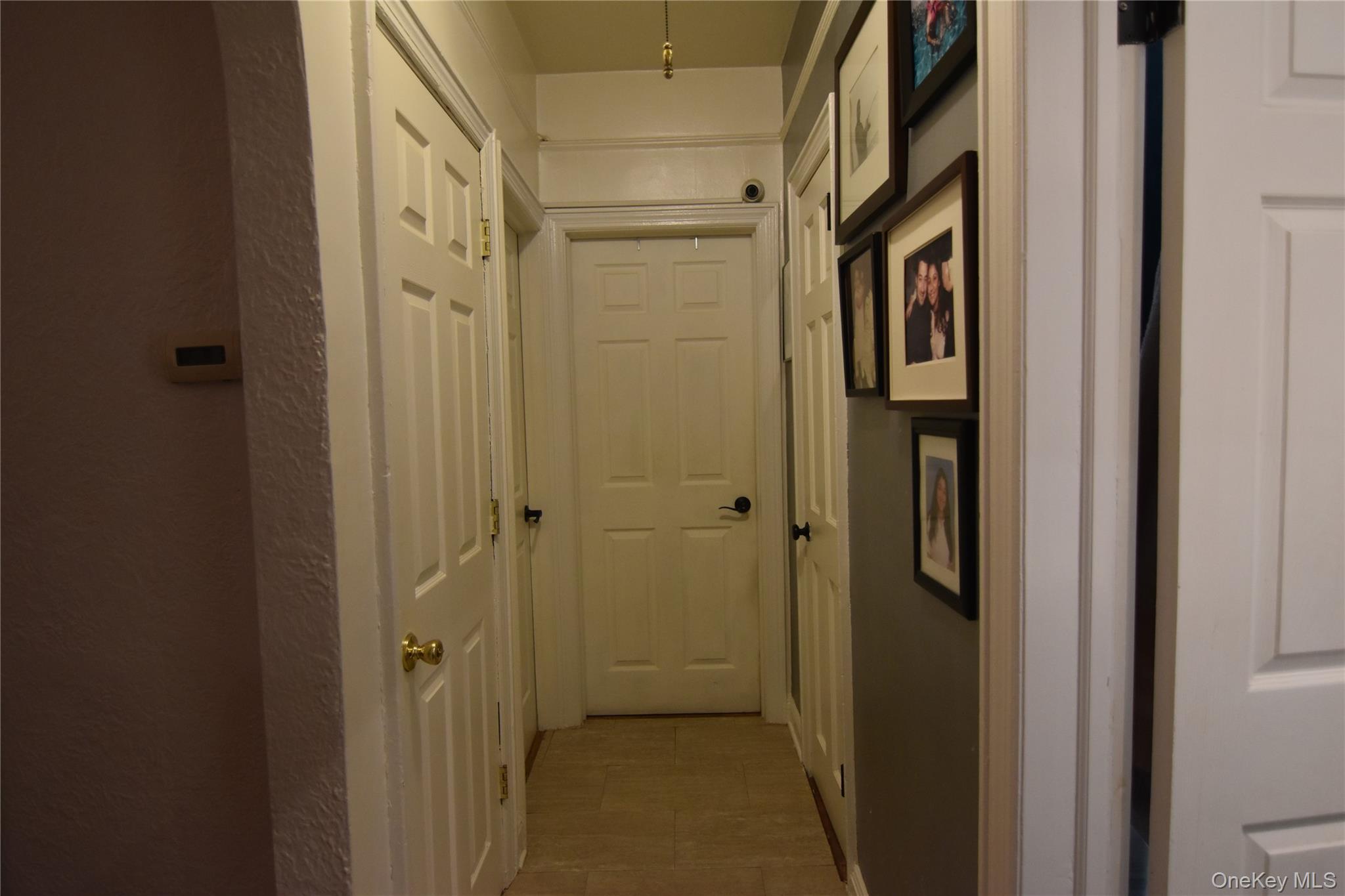 25-48 89th Street Queens, NY 11369 - Photo 10 of 17 a bathroom with a shower and a glass door