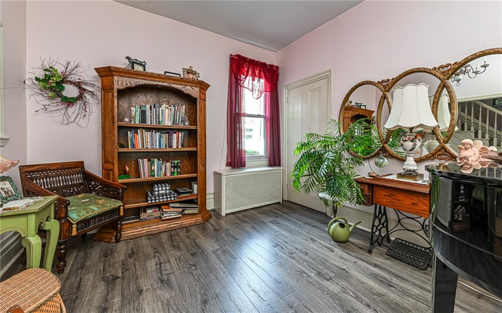 164 45th Street Pittsburgh, PA 15201 - Photo 12 of 47 a living room with furniture and a book shelf