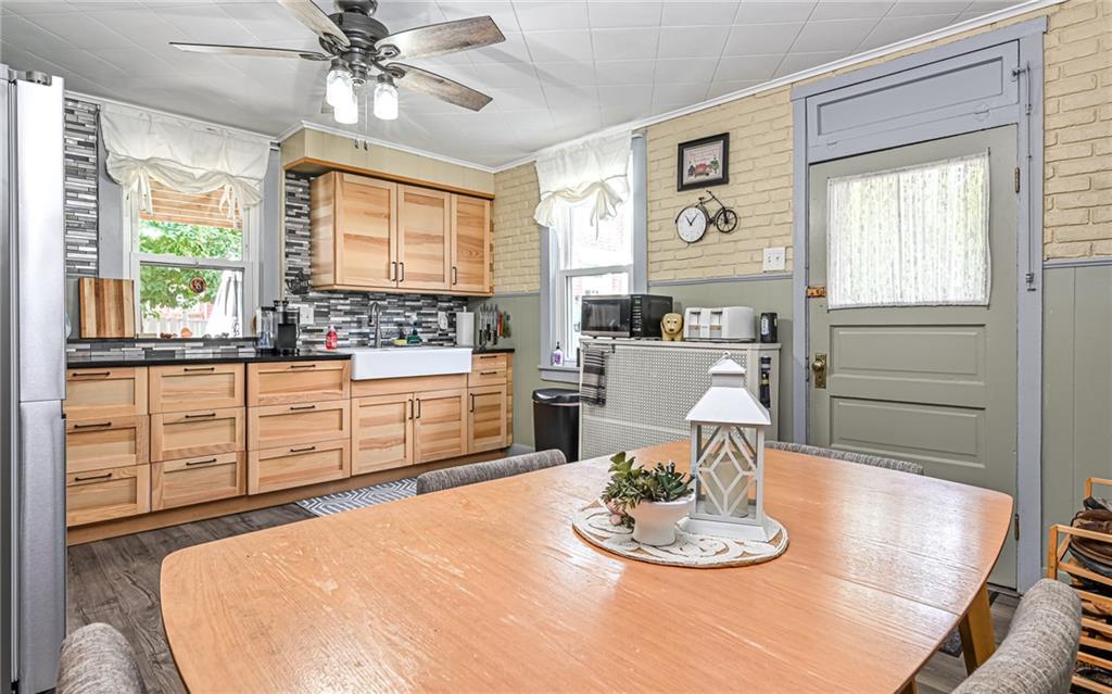 164 45th Street Pittsburgh, PA 15201 - Photo 15 of 47 a kitchen with a table and chairs