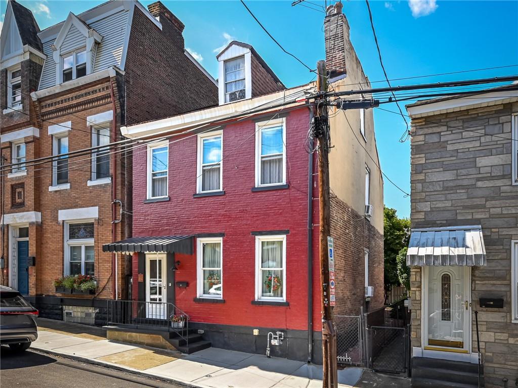 164 45th Street Pittsburgh, PA 15201 - Photo 2 of 47 a front view of a building with a street