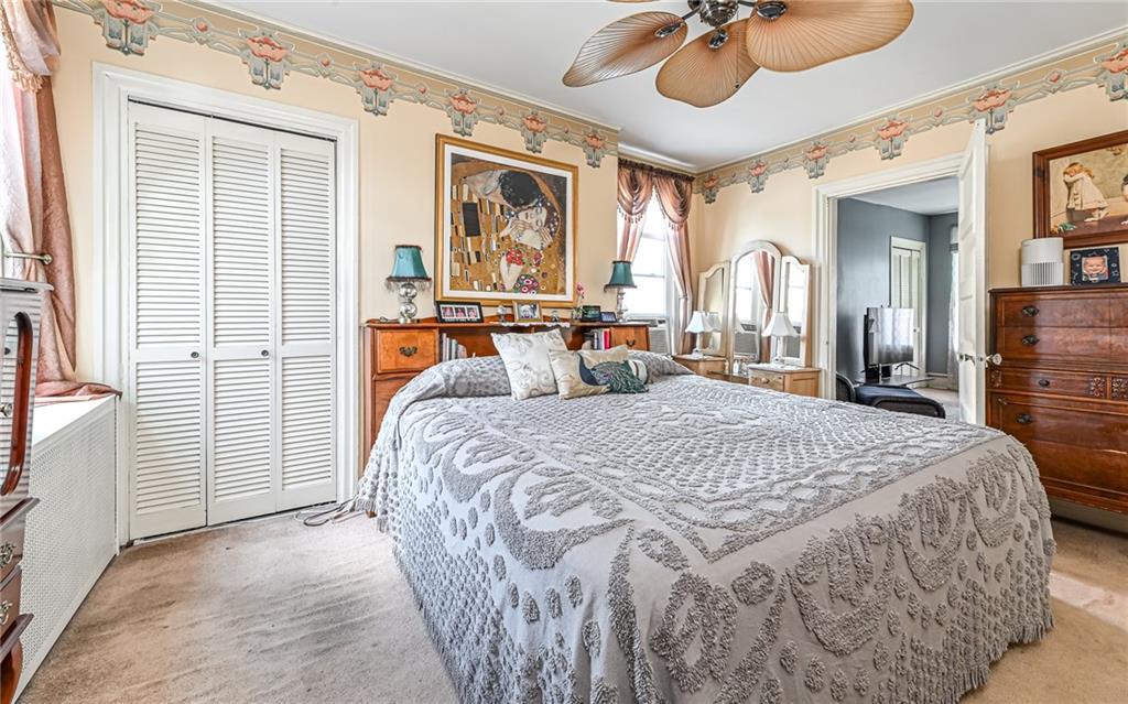 164 45th Street Pittsburgh, PA 15201 - Photo 22 of 47 a bedroom with a bed and window