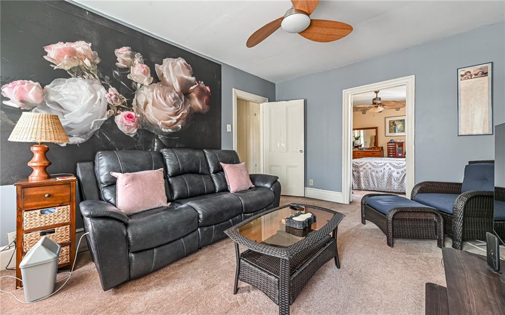 164 45th Street Pittsburgh, PA 15201 - Photo 24 of 47 a living room with furniture and a chandelier