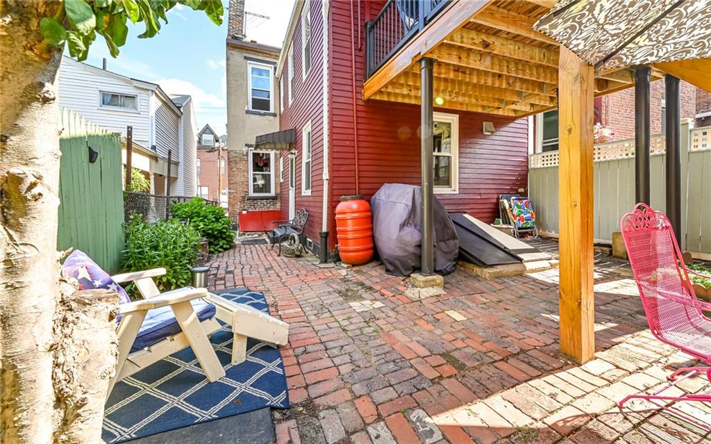 164 45th Street Pittsburgh, PA 15201 - Photo 35 of 47 a view of a patio with table and chairs and potted plants