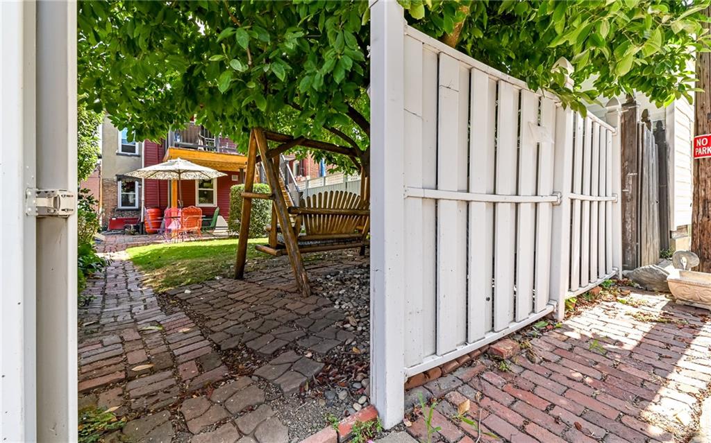 164 45th Street Pittsburgh, PA 15201 - Photo 37 of 47 a front view of a house with garden