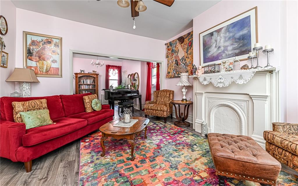 164 45th Street Pittsburgh, PA 15201 - Photo 8 of 47 a living room with furniture and a fireplace