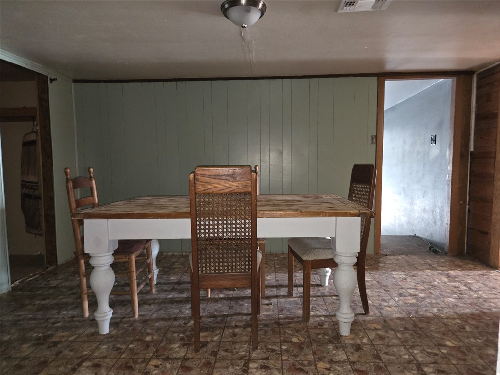 305 East Laredo Street Freer, TX 78357 - Photo 8 of 19 a dining room with furniture and wooden floor