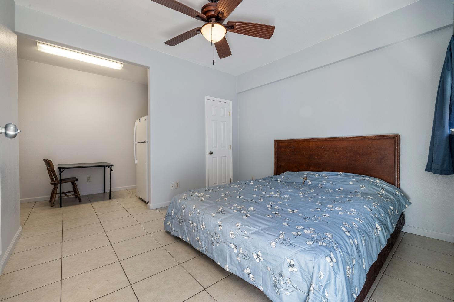 3105 Ripple Court Modesto, CA 95355 - Photo 41 of 46 a bedroom with a bed and a chandelier