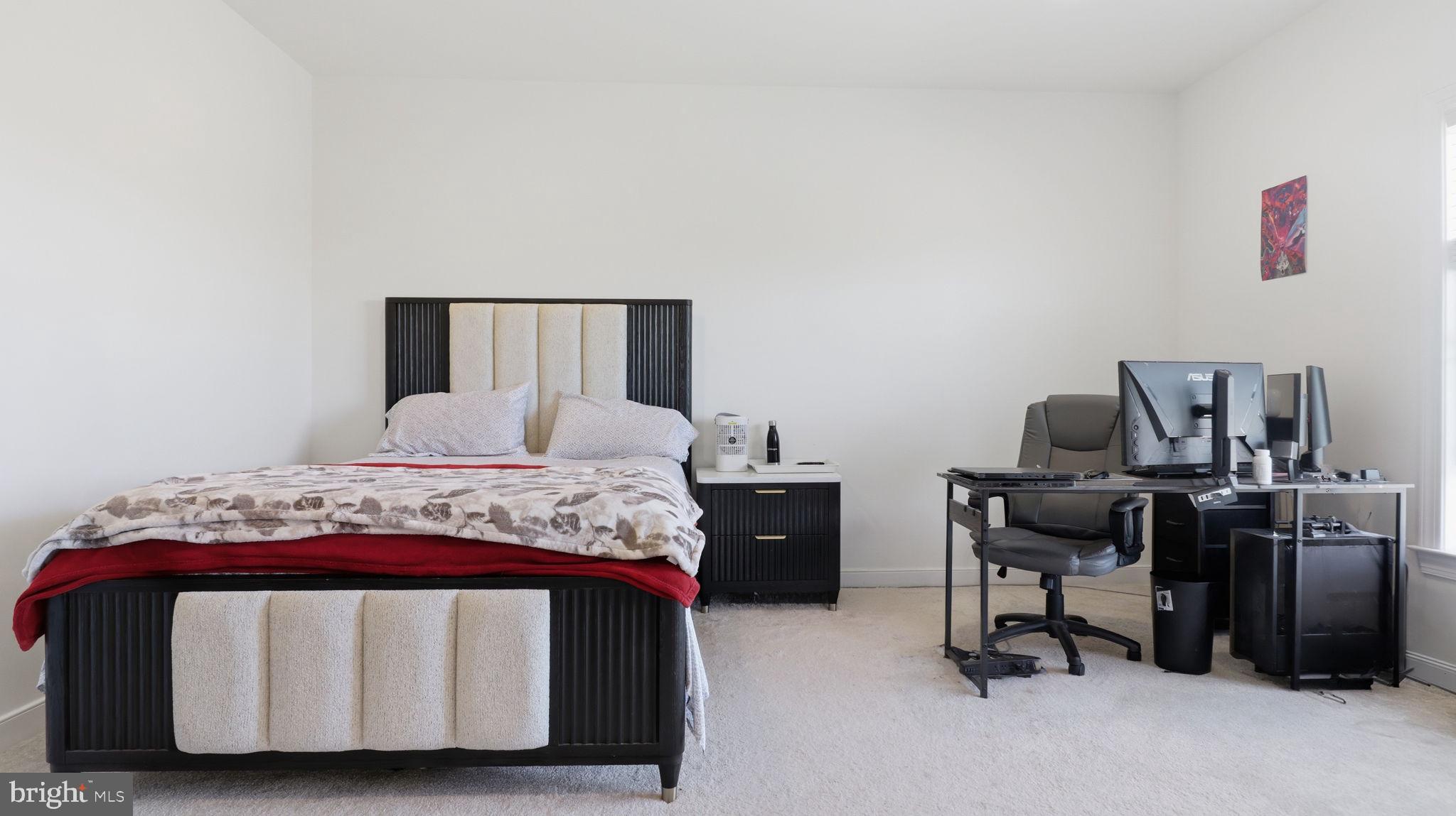 11502 Aden Road Nokesville, VA 20181 - Photo 53 of 106 a bedroom with a bed and a desk