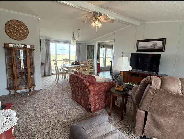 a bathroom with a double vanity sink a mirror and a toilet