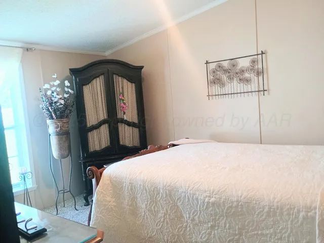 a view of a grassy field with trees