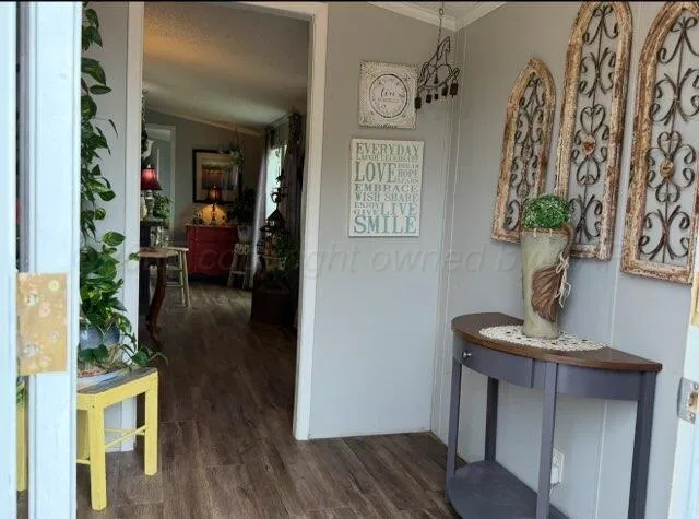 a bathroom with a toilet and a shower curtain