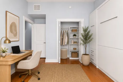 a workspace with furniture and window