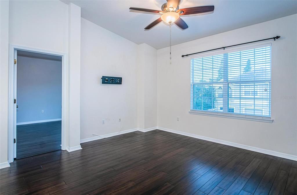 9013 Moonlit Meadows Loop Riverview, FL 33578 - Photo 13 of 43 a view of a room with wooden floor and windows