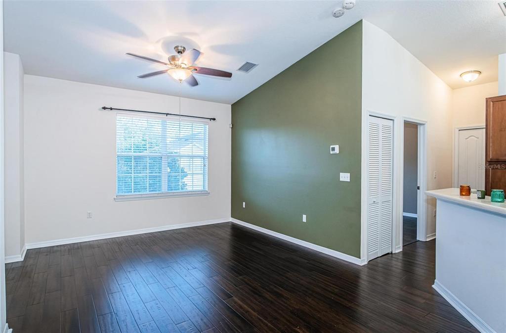 9013 Moonlit Meadows Loop Riverview, FL 33578 - Photo 14 of 43 an empty room with wooden floor fan and windows