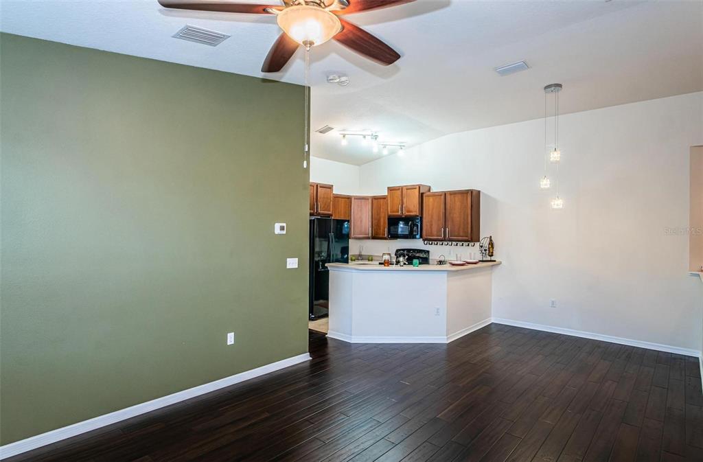 9013 Moonlit Meadows Loop Riverview, FL 33578 - Photo 15 of 43 a room with window and wooden floor